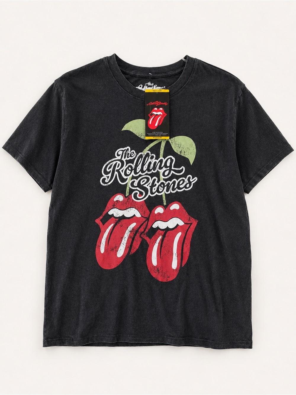 The Rolling Stones Black Tee with Red Tongue Graphic and Green Leaves